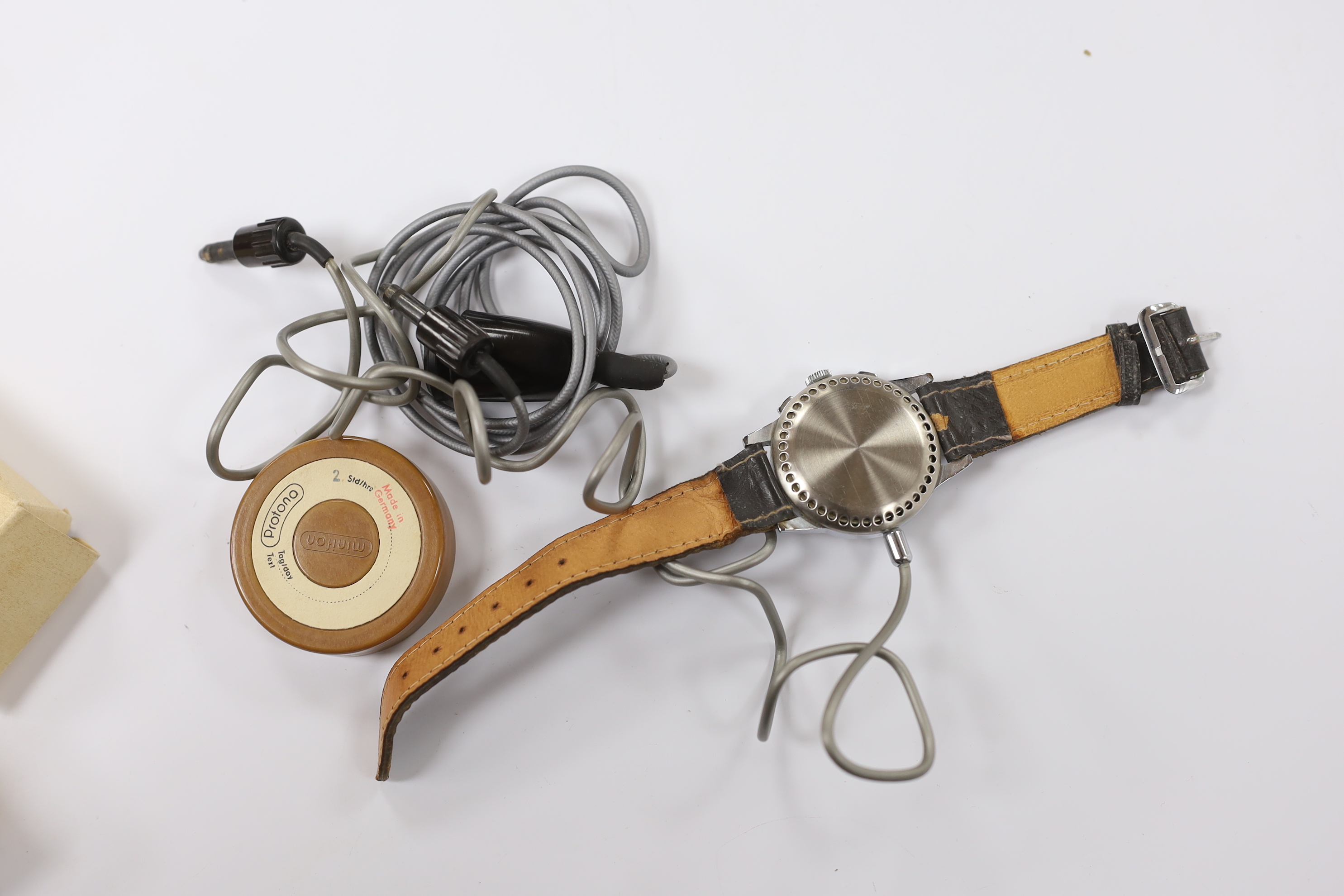 A gentleman's 1950s German steel Protona Minifon Surveillance wrist watch with cables and attachments.